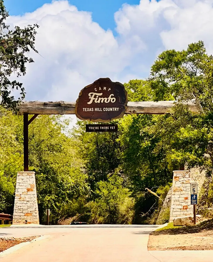 Overhead image of Camp Fimfo entry road and sign