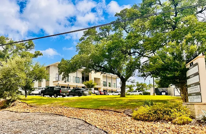 The Herbelin Plaza building next to the Herbelin Plaza sign.